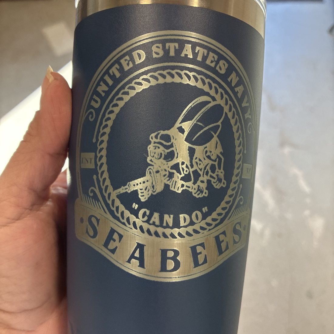 Navy insulated tumbler engraved with a United States Navy Seabees emblem