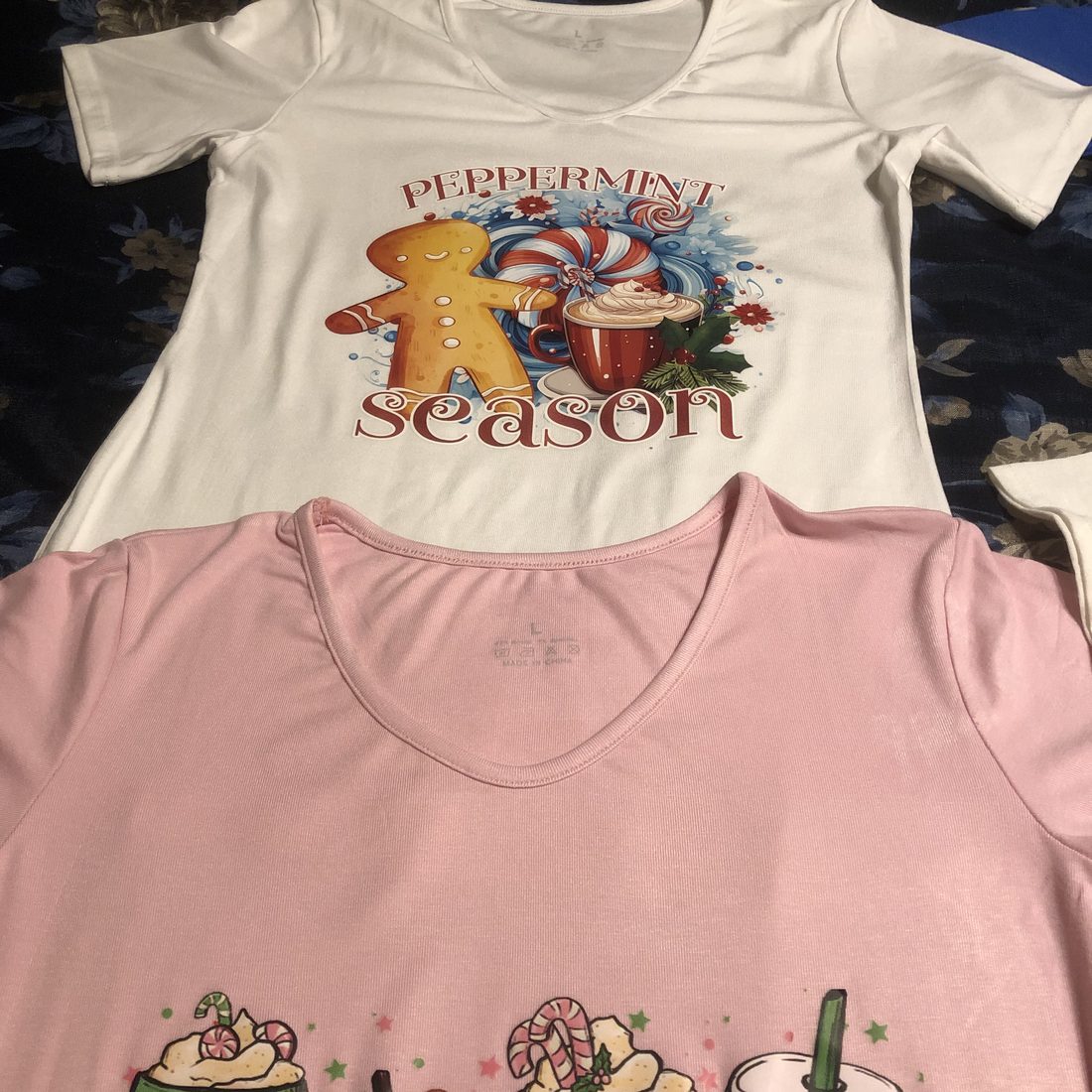 Printed shirts with holiday designs, one white and one pink